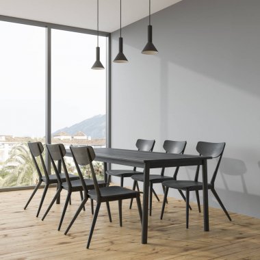 Bir gri Oda köşede koyu gri yemek masası