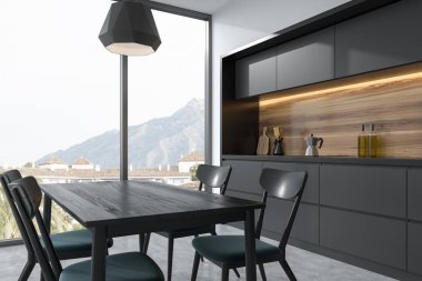 Koyu gri yemek masası bir gri mutfak köşesi