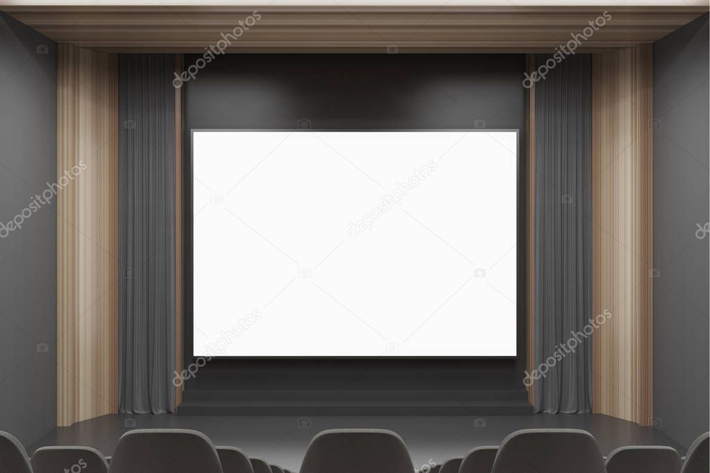 Cinema interior, black chairs, screen