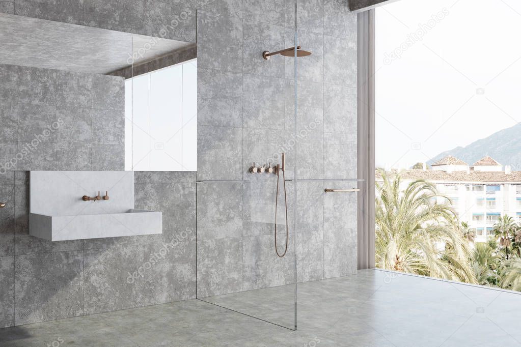 Concrete bathroom, sink and shower corner
