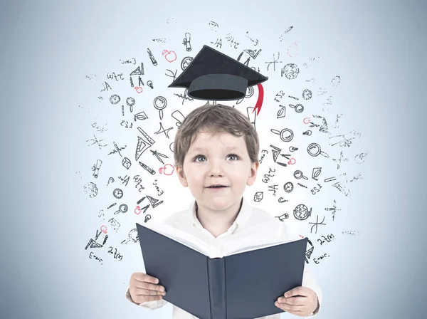 Cute little boy with a book, learning — Stock Photo, Image