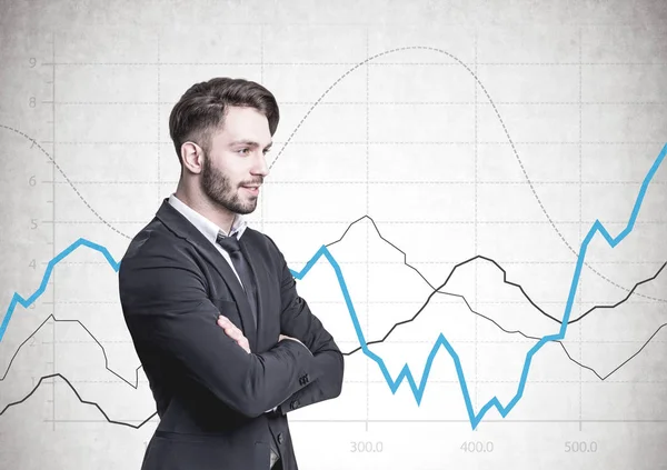 Pensive bearded businessman, side view, graphs — Stock Photo, Image