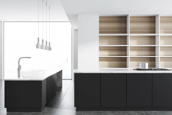 Schwarze Arbeitsplatten in einer weißen Küche — Stockfoto