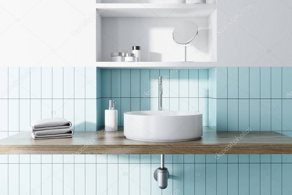 Sink in a blue and white bathroom interior