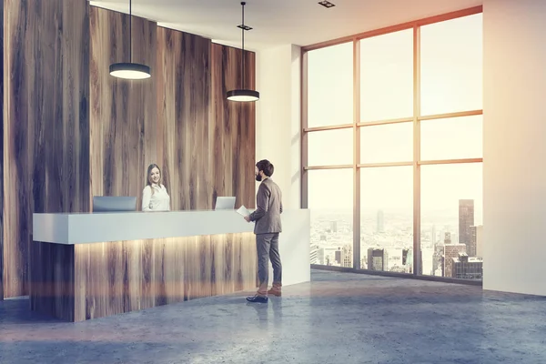 Wooden and white reception office lobby corner man