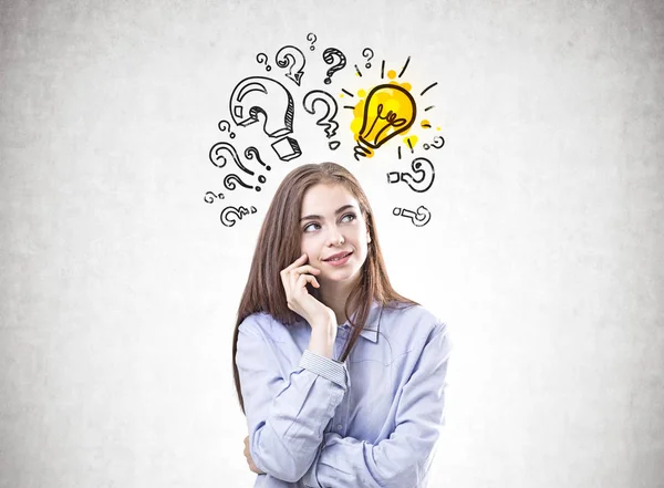 Dreamy young woman in a blue shirt, answer — Stock Photo, Image