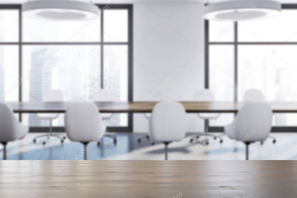 White boardroom room, white chairs blur
