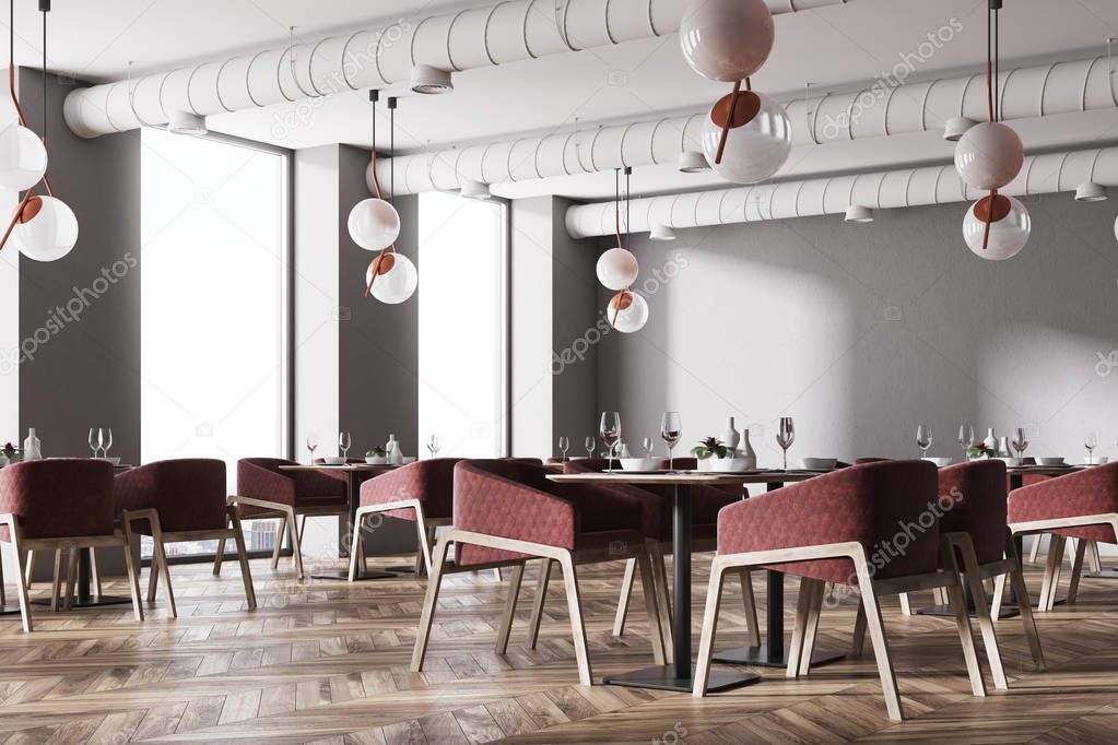 Corner of a loft cafe with red chairs