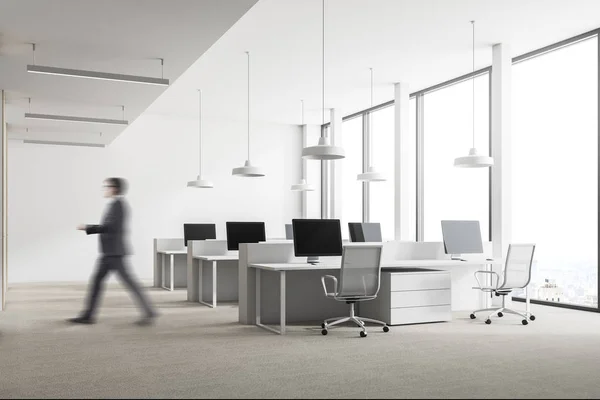 Businessman in a loft white office — Stock Photo, Image