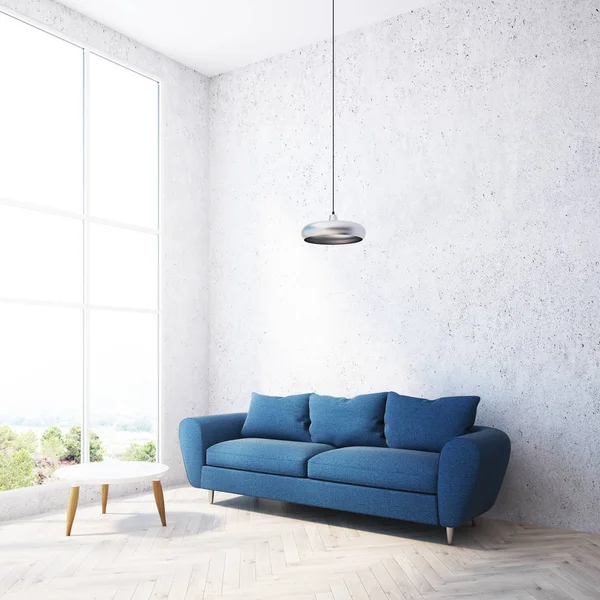 Concrete wall living room corner with a soft blue sofa and a small round coffee table near a loft window. 3d rendering mock up