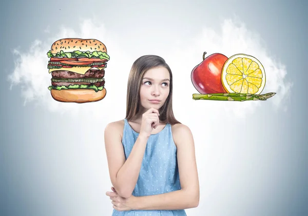 Pensive Teen Girl Blue Dress Standing Gray Wall Hamburger Fruits — Stock Photo, Image
