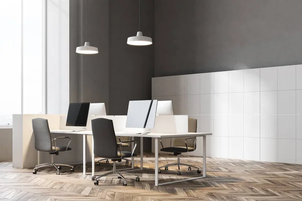 Black chairs open office corner with a wooden floor, rows of computer desks and black office chairs near them. 3d rendering mock up