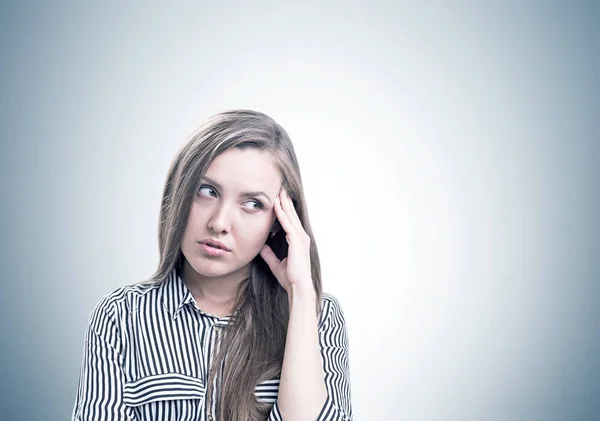 Pensive young woman portrait, gray — Stock Photo, Image