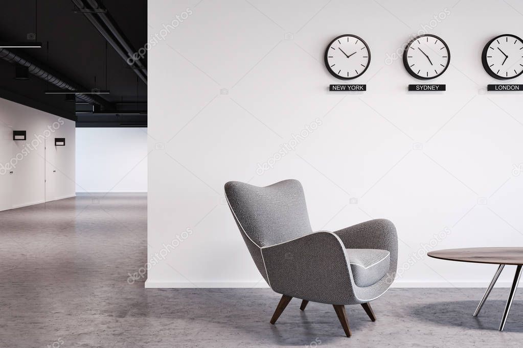 White wall office lobby with clocks close up