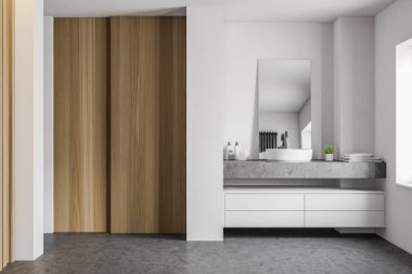 Beyaz ve ahşap banyo içi lavaboyla dolu.