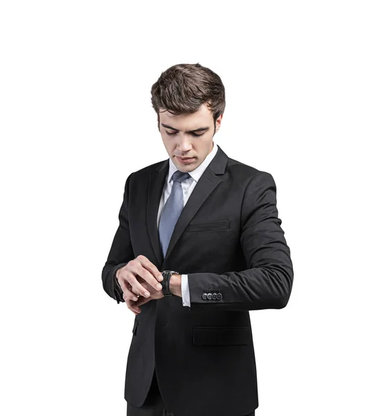 Attentive businessman looking at watch, isolated — Stock Photo, Image