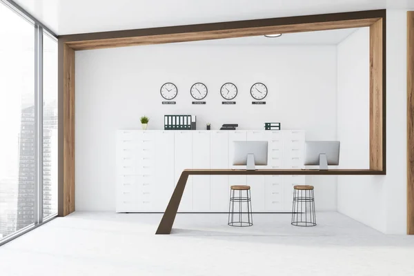 White and wooden open space office with clocks — Stock Photo, Image
