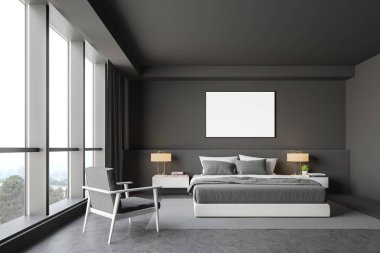 Gri yatak odası içi, koltuk ve poster.