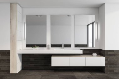 İçi lavabo dolu beyaz ve gri fayanslı banyo.