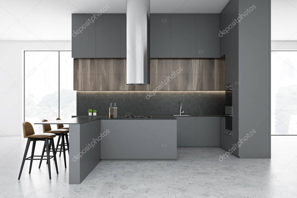 Side view of gray and white kitchen with bar