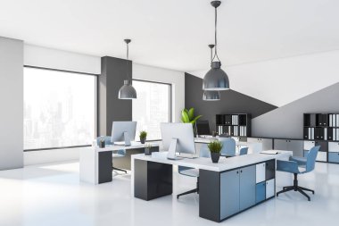 Gri ve beyaz açık alan ofis köşesi