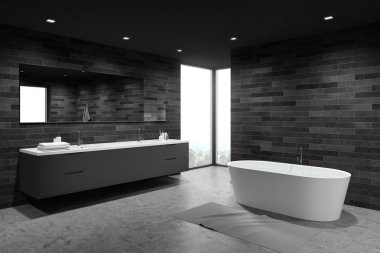 Koyu fayanslı ferah banyo köşesi, küvet ve lavabo