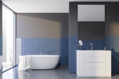 Gri ve mavi fayanslı banyo içi, küvet ve lavabo