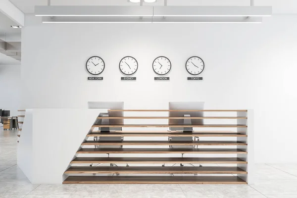 stock image White office interior with reception and clocks