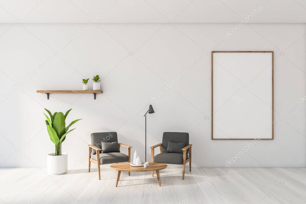 White living room with gray armchairs and poster