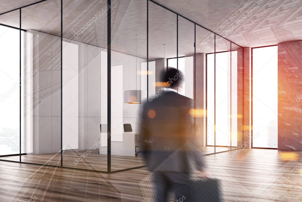 Businessman entering white conference room