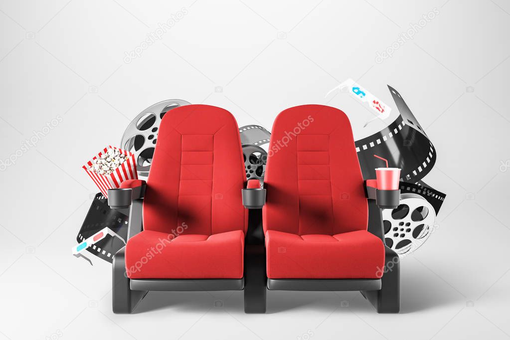 Two red cinema chairs over white background