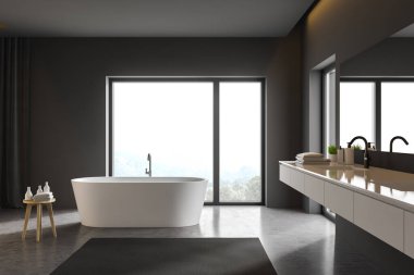 Gri banyo içi lavabo ve küvetle dolu