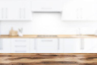 Tezgahları olan bulanık beyaz bir mutfak masası.