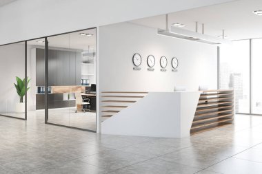 Beyaz ofiste saatleri olan resepsiyon masası