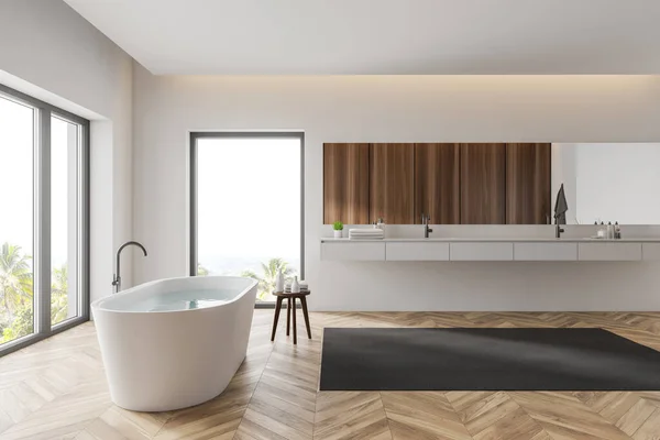 Vista laterale del bagno bianco con lavabo e vasca — Foto Stock