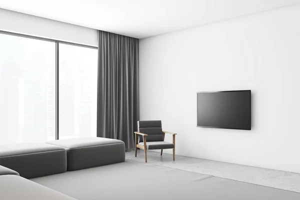 Angolo soggiorno bianco con poltrona e TV — Foto Stock