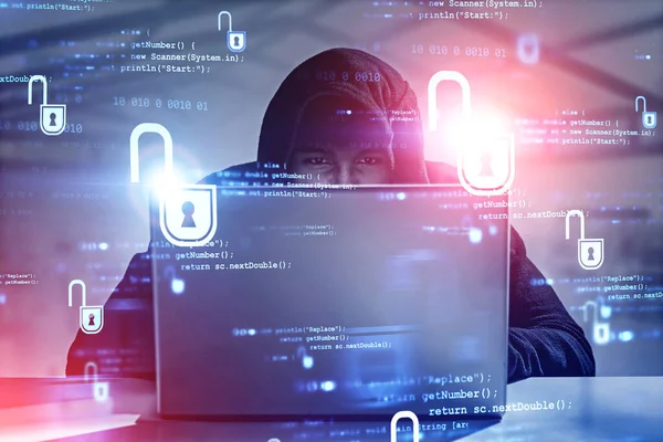 Young hacker with laptop in office, cyber security — Stock Photo, Image