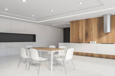 Ahşap ve gri mutfak köşesinde masa var.