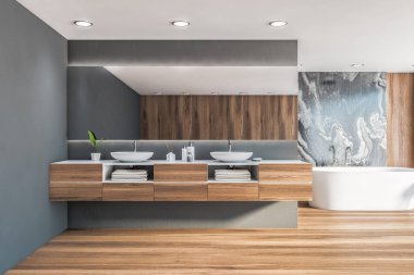 Çift lavabolu siyah mermer banyo.