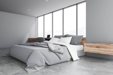 Bilgisayar masası olan gri yatak odası köşesi