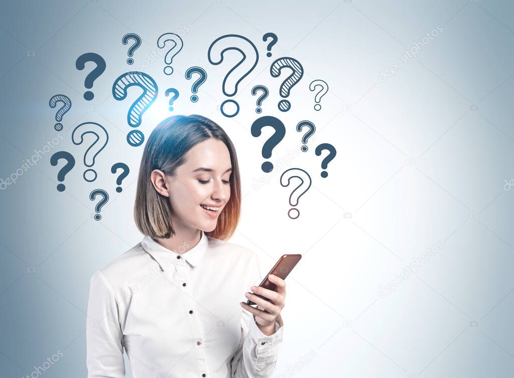 Woman with smartphone and question marks