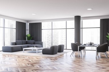 Gri oturma odası ve yemek odası köşesi.