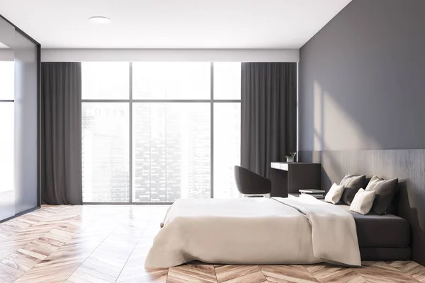 Side view of gray master bedroom with armchair — Stock Photo, Image