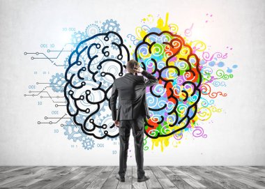 Kafası karışmış adam sol ve sağ beyne bakıyor.