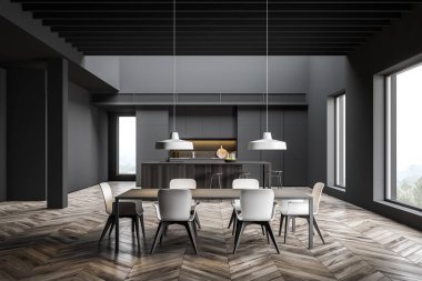 Bar ve yemek masası olan geniş gri mutfak.