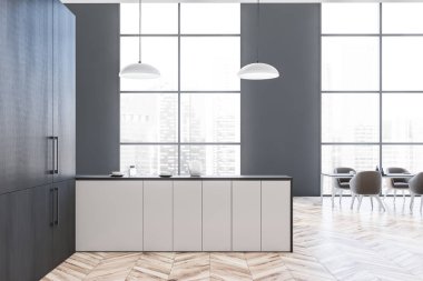 Gri yemek odası ve mutfak tezgahlı.