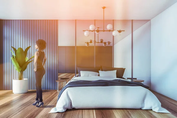 African woman in blue master bedroom — Stock Photo, Image