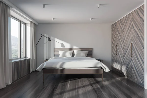 Biała i ciemna drewniana sypialnia z szafą — Zdjęcie stockowe