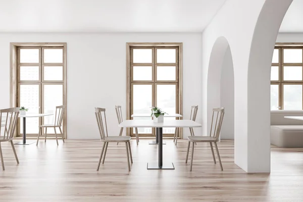 Modern white cafe interior with sofa