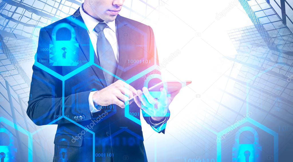 Businessman with tablet in city, cyber security